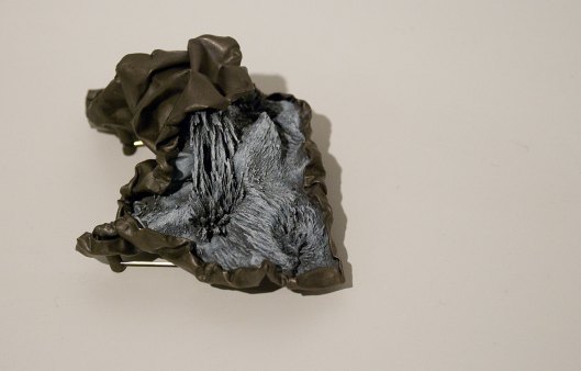 Ying-Hsun (Zita) Hsu - Brooch (2013). Brass, iron magnetized, epoxy resin. Photo by Eleni Roumpou